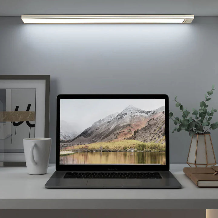 Ultra-slim motion sensor cabinet light in sleek aluminum, black or silver, 9mm thick, 20-60cm, versatile, hands-free.