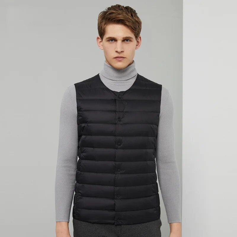 Travel-friendly men's down vest, offering lightweight warmth and freedom for versatile fashion.