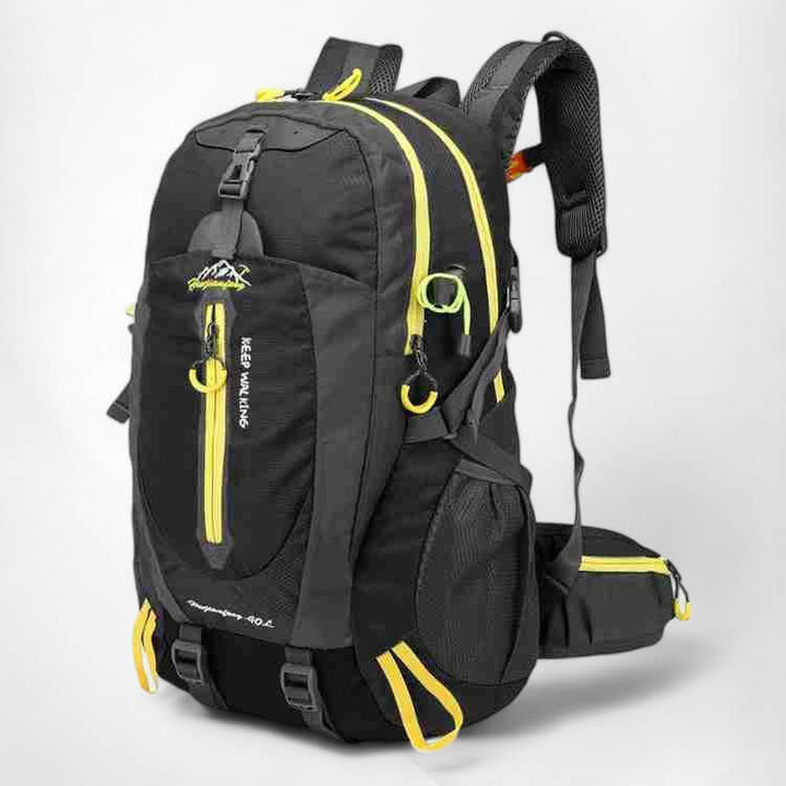 Person wearing a 40L waterproof hiking backpack on a scenic trail, ready for trekking and camping in nature.
