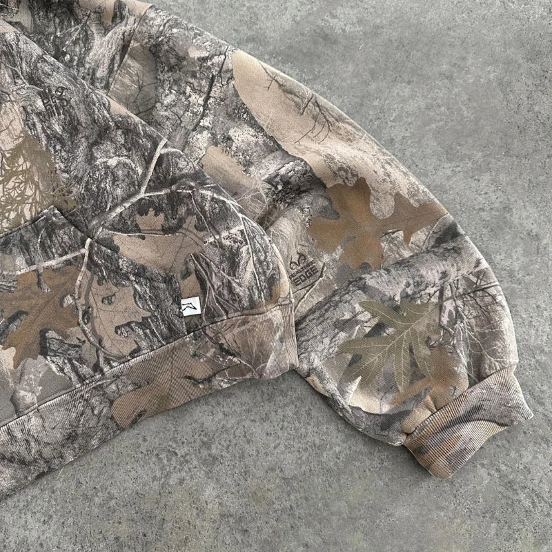 "Unisex camo streetwear hoodie with tactical print, front view. Urban and outdoor style, men's jackets and coats collection."