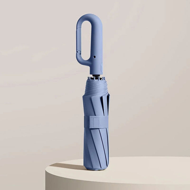 "Unisex compact umbrella with UV protection, featuring a reinforced frame, sleek design, and ergonomic handle in various colo
