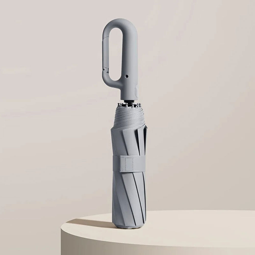 "Unisex compact umbrella with UV protection, featuring a reinforced frame, sleek design, and ergonomic handle in various colo