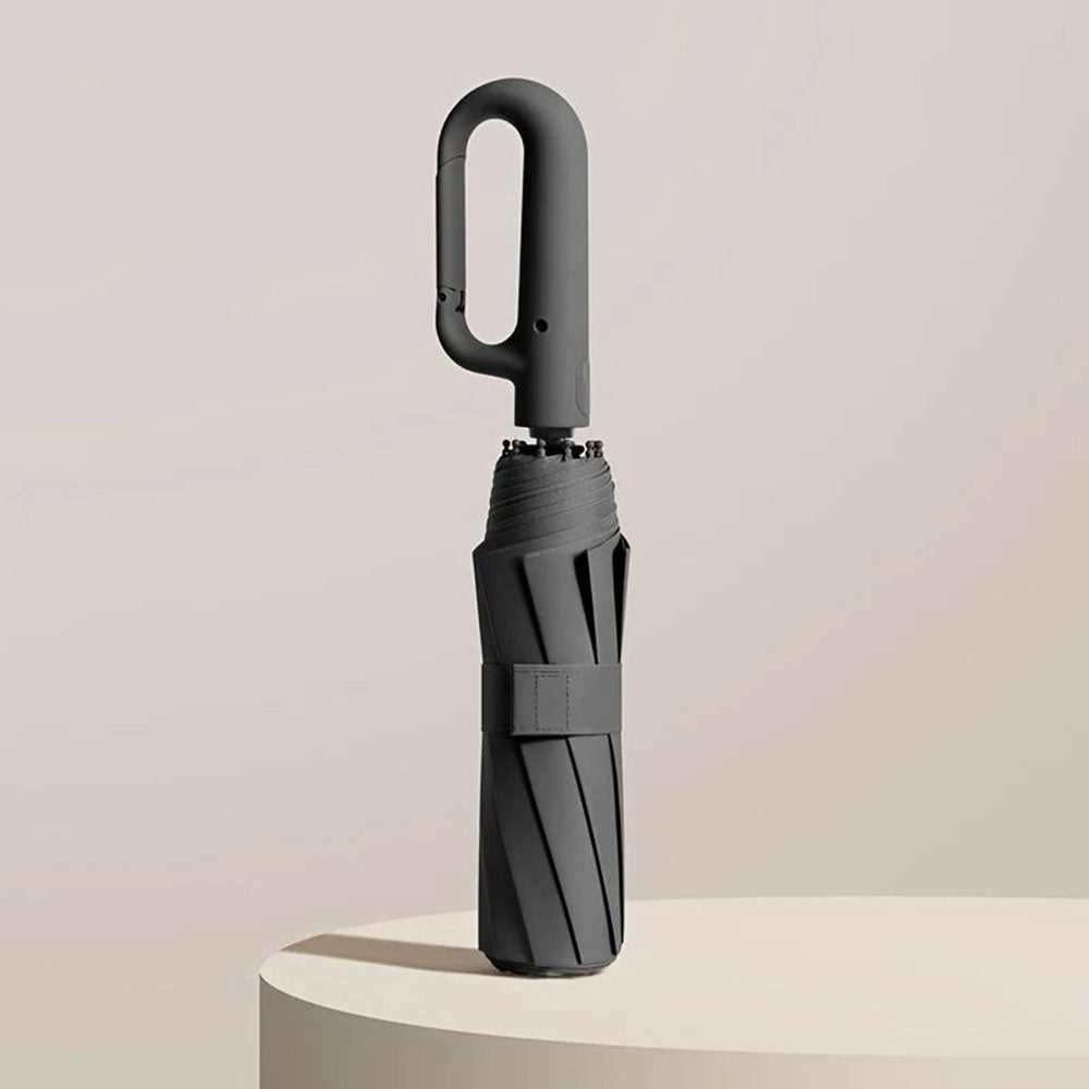"Unisex compact umbrella with UV protection, featuring a reinforced frame, sleek design, and ergonomic handle in various colo