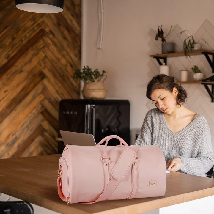 Travel organizer duffel bag with dedicated garment compartment for neat packing.