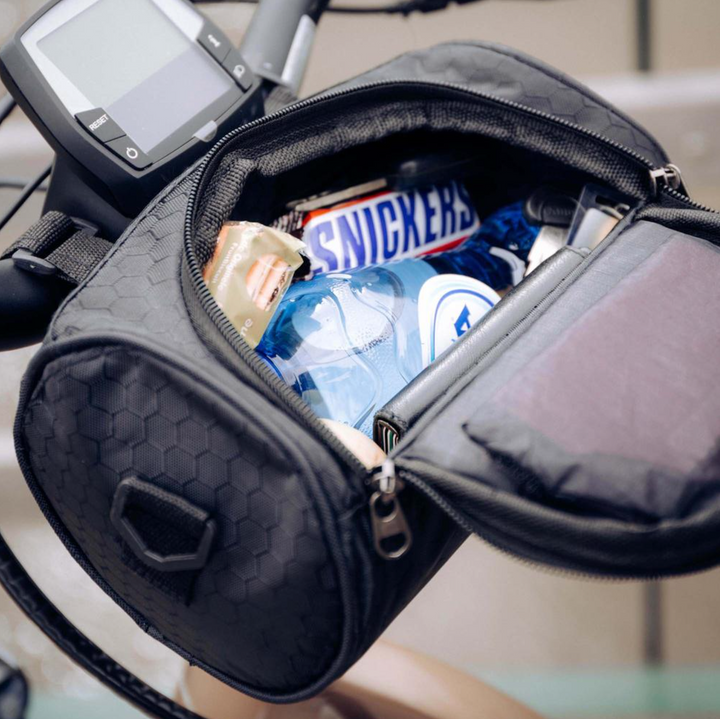 Compact bicycle handlebar bag, perfect for commuters. Features touch-screen compatible phone holder.