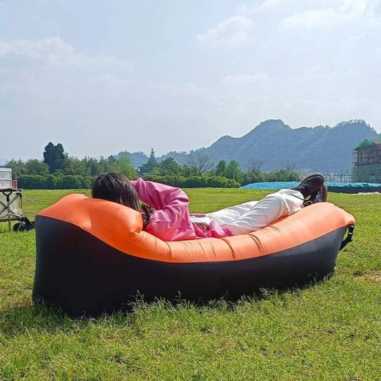 Unisex easy-inflate vibrant inflatable lounger; lightweight & durable for all outdoor travel & relaxation needs.