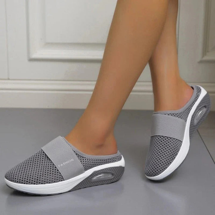 Unisex everyday comfort slippers for all-day foot support. Lightweight & breathable slip-on design for indoor/outdoor.