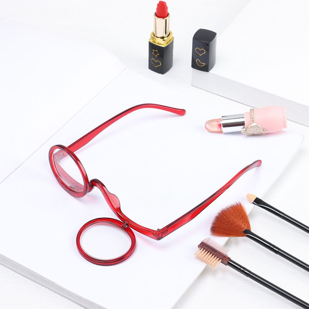 Close-up of flip-down magnifying glasses, showing clarity for intricate eyeliner & eyeshadow.