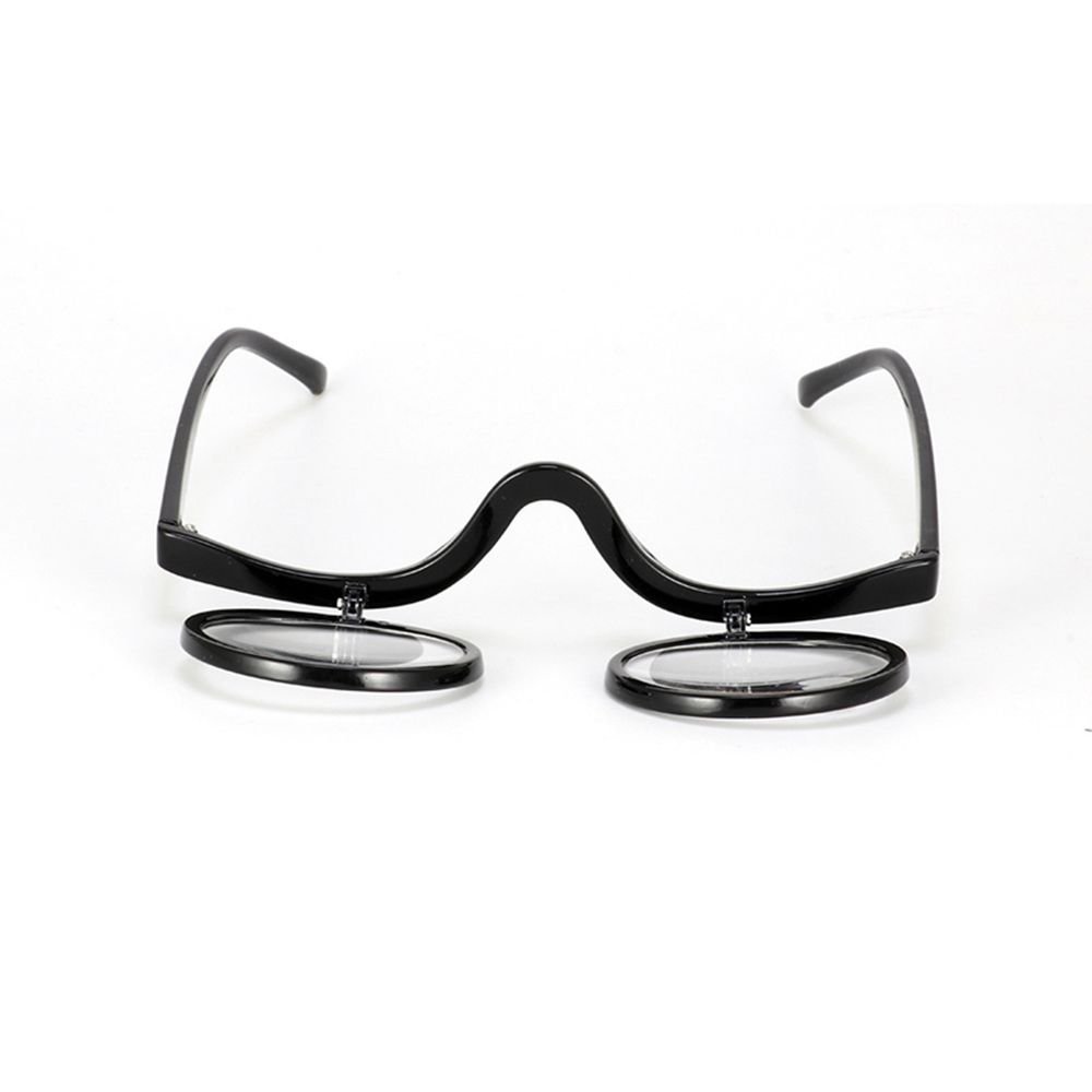 Detailed view of flip-down magnifying glasses, emphasizing ease of use for precise makeup application.