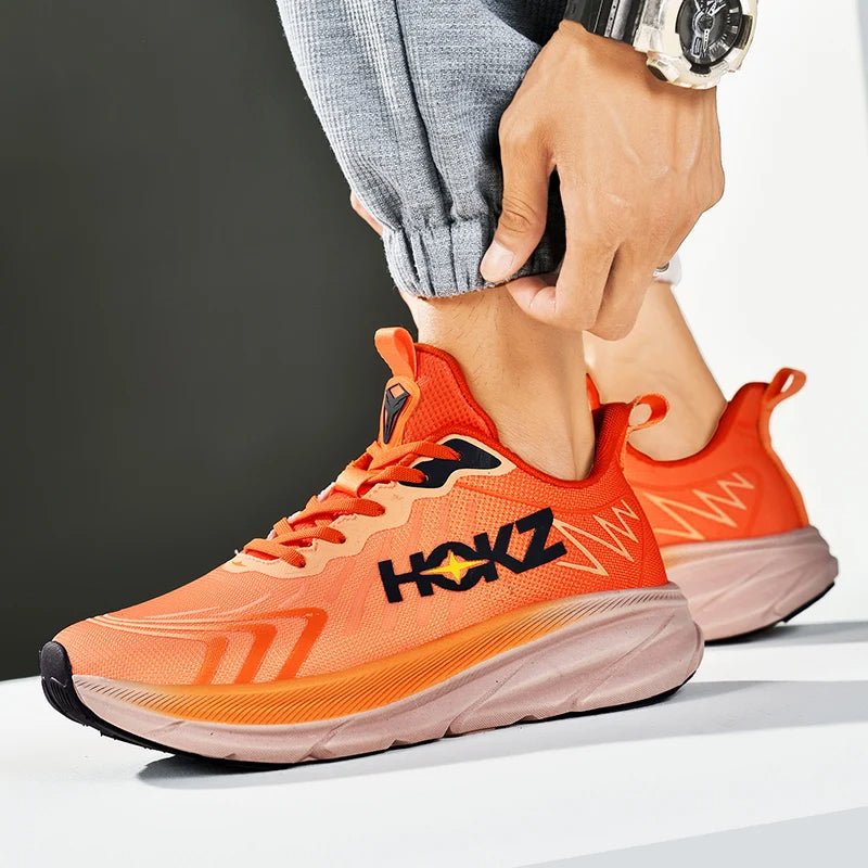 Sleek unisex running shoes, lightweight design for optimal performance & training. Comfortable sports footwear.