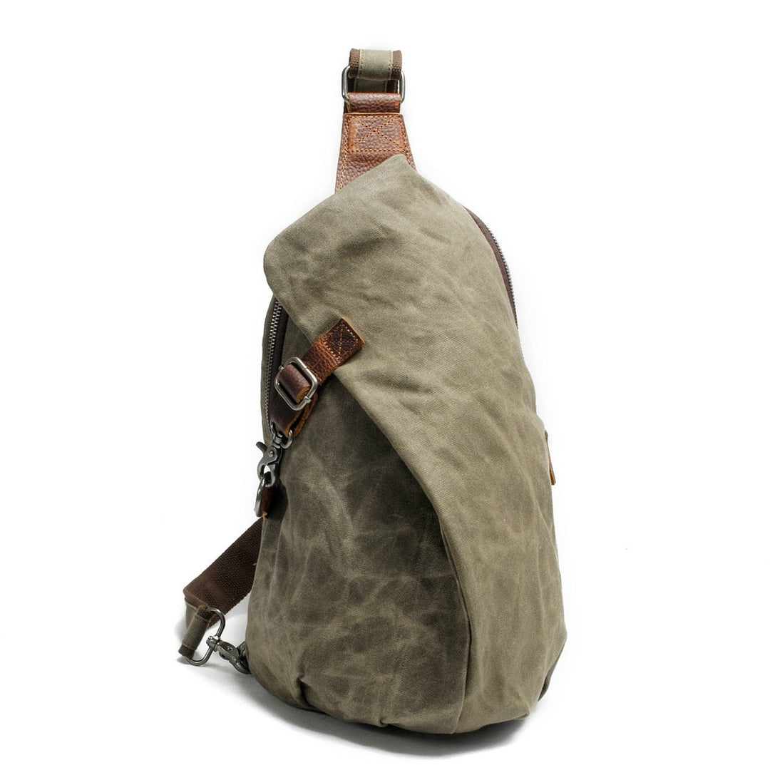 Durable canvas sling bag with anti-theft pocket for secure daily essentials.