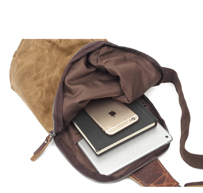 Grey canvas crossbody bag, organizational features for men and women.