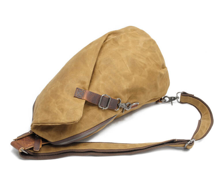 Man wearing a water-resistant canvas crossbody bag, active lifestyle.