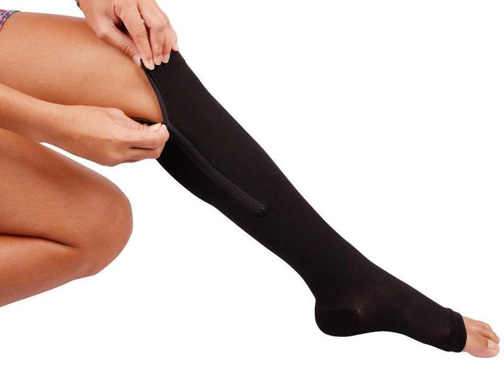 "Unisex zippered compression socks 20-30 mmHg, black, open-toe design, graduated pressure for leg fatigue relief."