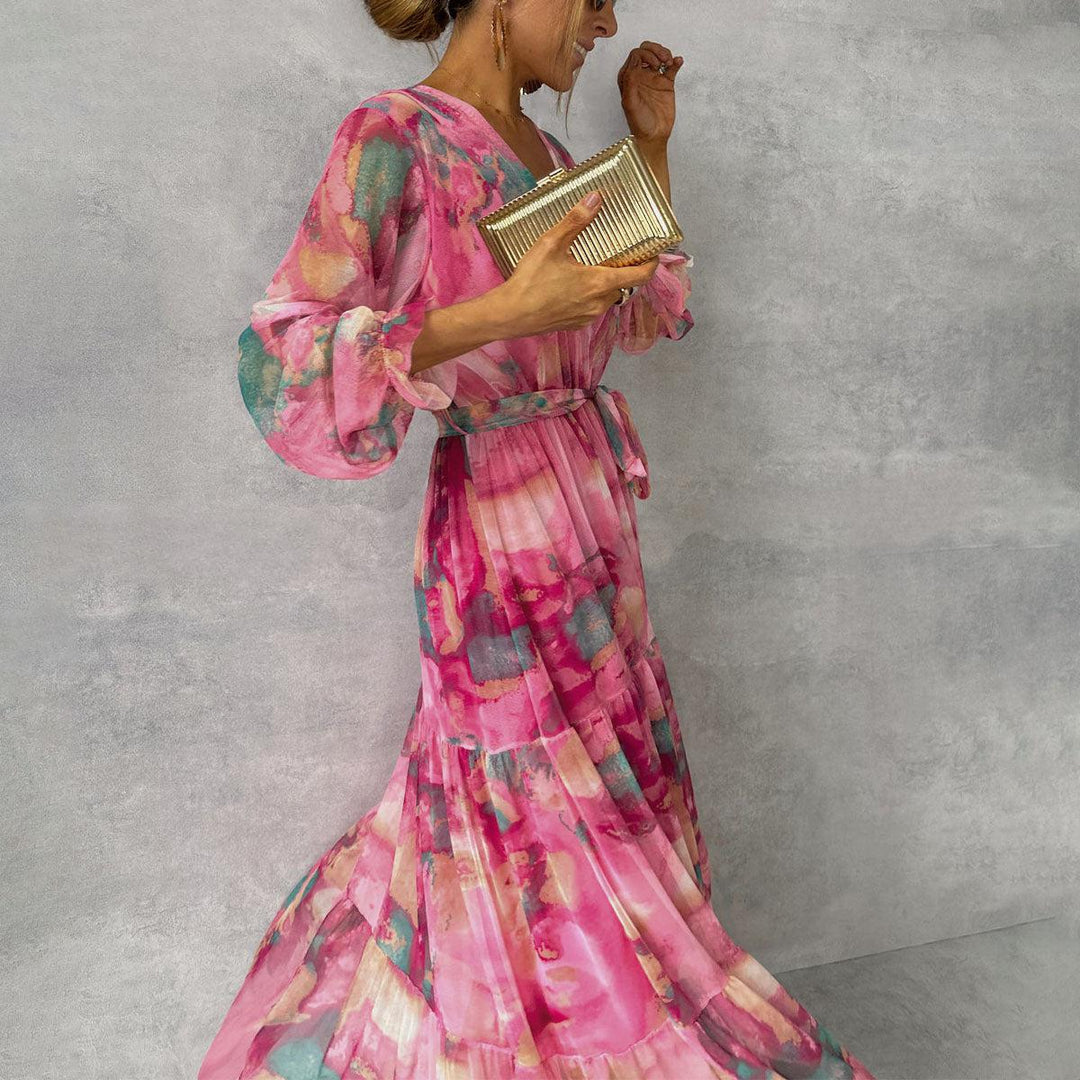 Women's vibrant floral print wrap maxi dress, featuring a flowy tiered skirt and V-neck, great for elegance.