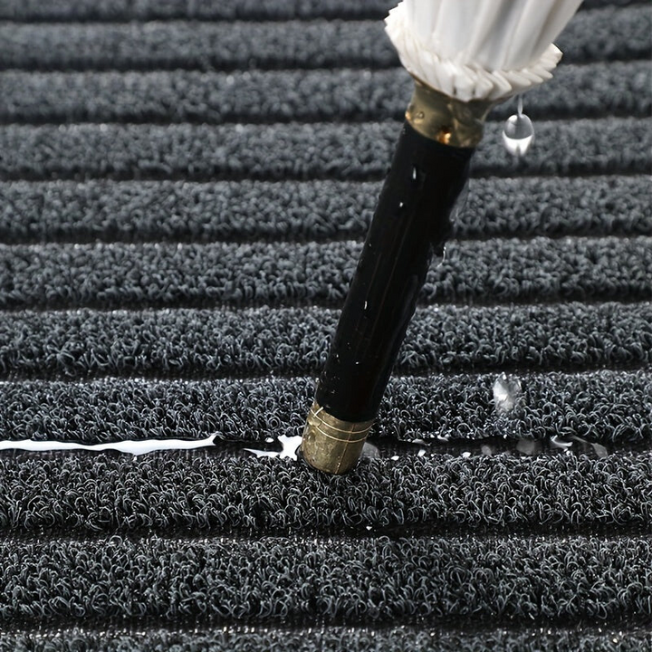 Heavy-duty weatherproof doormat for all seasons. Traps dirt & debris, durable for indoor & outdoor entryways.