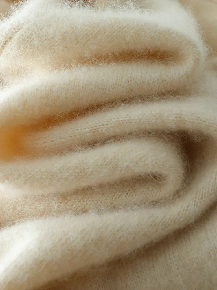 Woman posing in a comfortable beige cashmere crossover sweater, premium