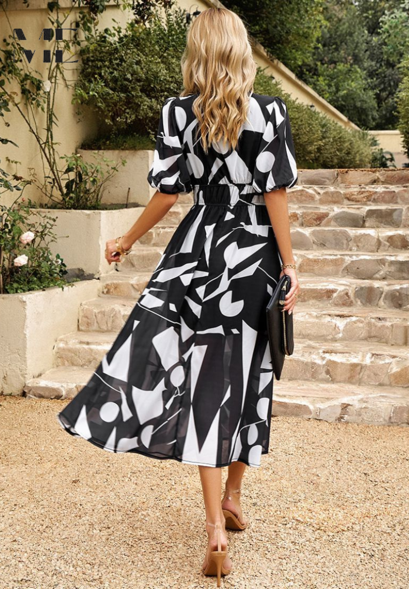 Back view of the women's abstract print midi dress, versatile and stylish.