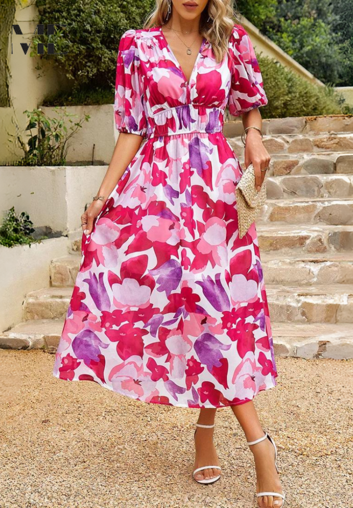 Fashionable women's midi dress with an eye-catching abstract pattern and belt.