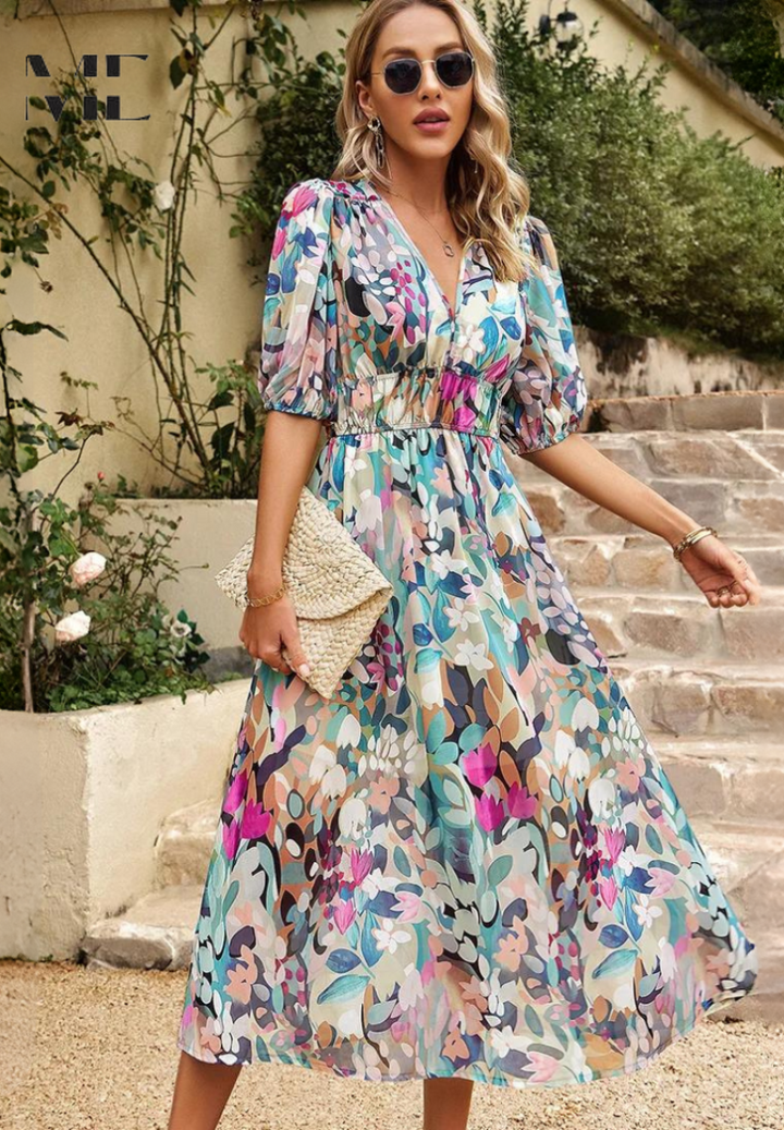 Full shot of women wearing a stylish abstract print belted midi dress.