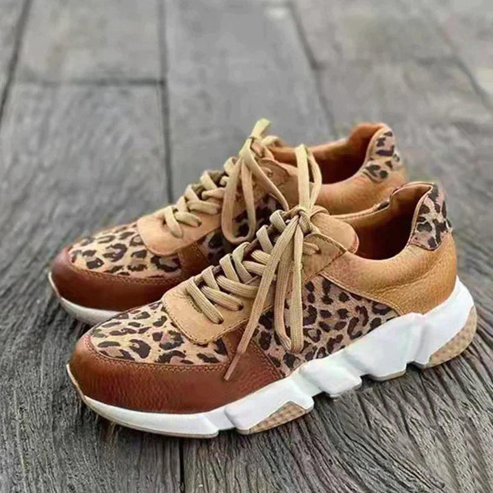 Women's animal print lace-up sneakers, stylish and comfortable for streetwear, athletic fashion.