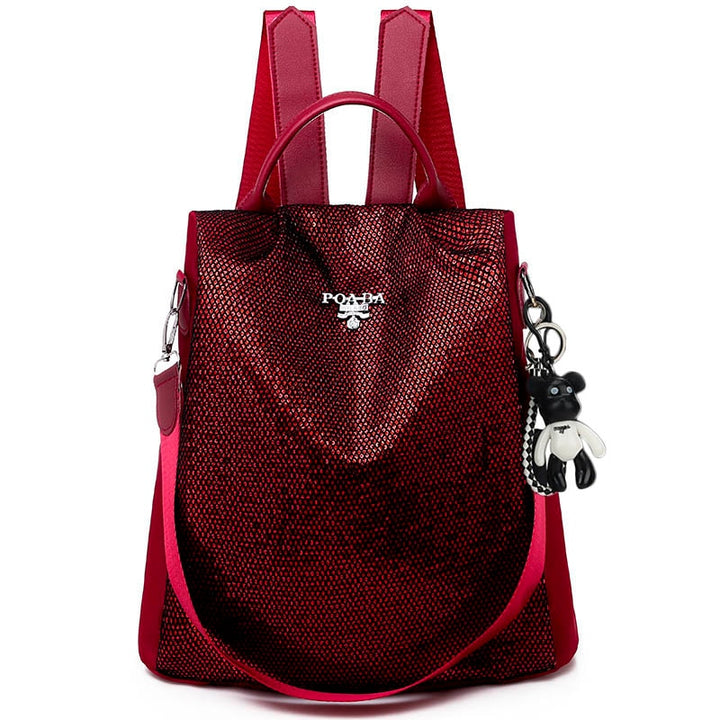 Woman wearing stylish anti-theft purse backpack, a water-resistant daily bag for urban travel & security.