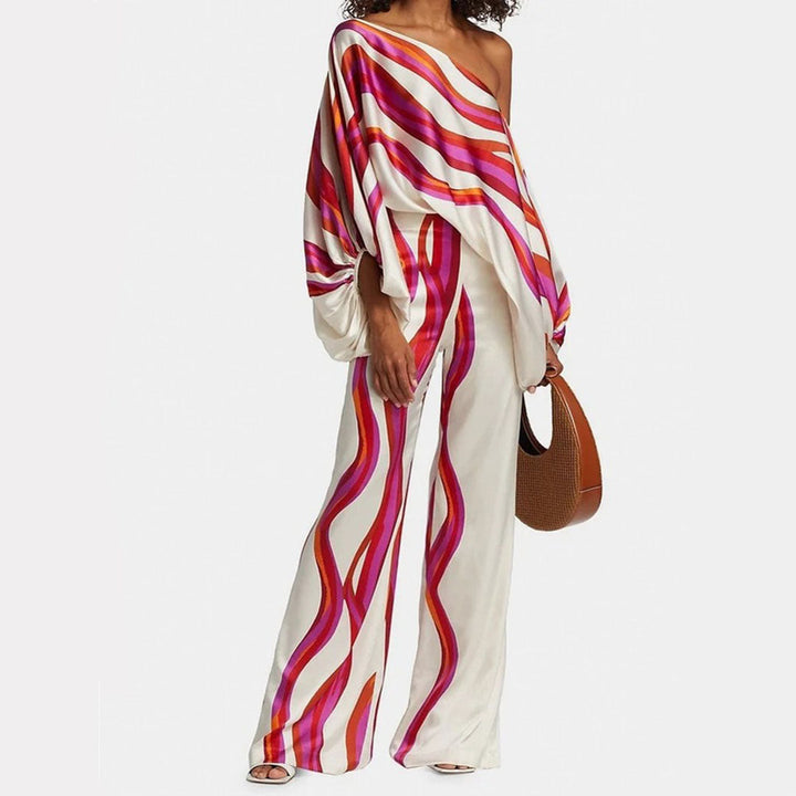 Elegant women's one-shoulder top & wide leg pants set. Abstract artistic print, perfect for vacation.