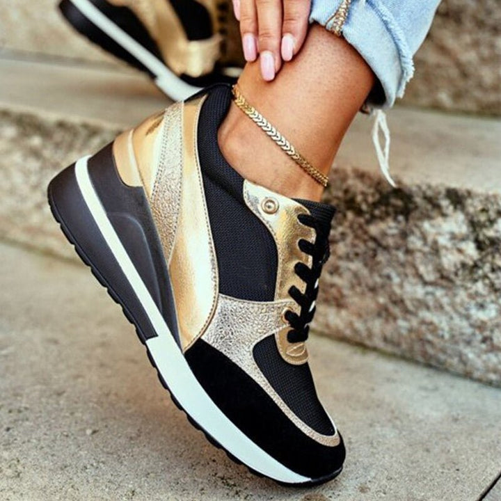 Side view of 'Aurora' women's non-slip sneakers, highlighting modern design & comfort features.