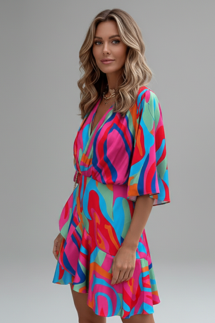 Elegant printed mini dress for women, with batwing sleeves, V-neck, and cinching tie waist.