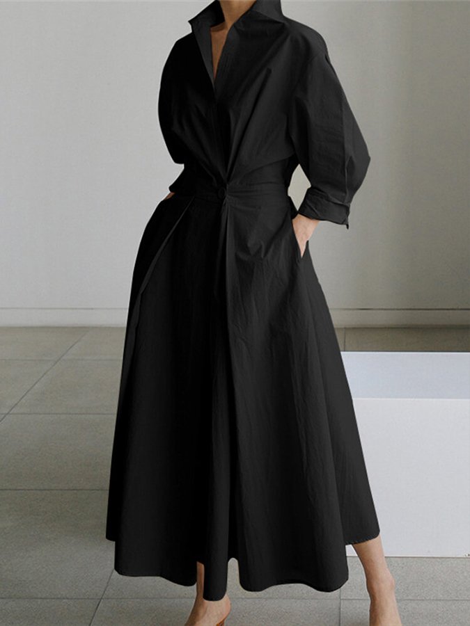 Elegant women's belted shirt dress, a maxi length and button detailing, suitable for various occasions.