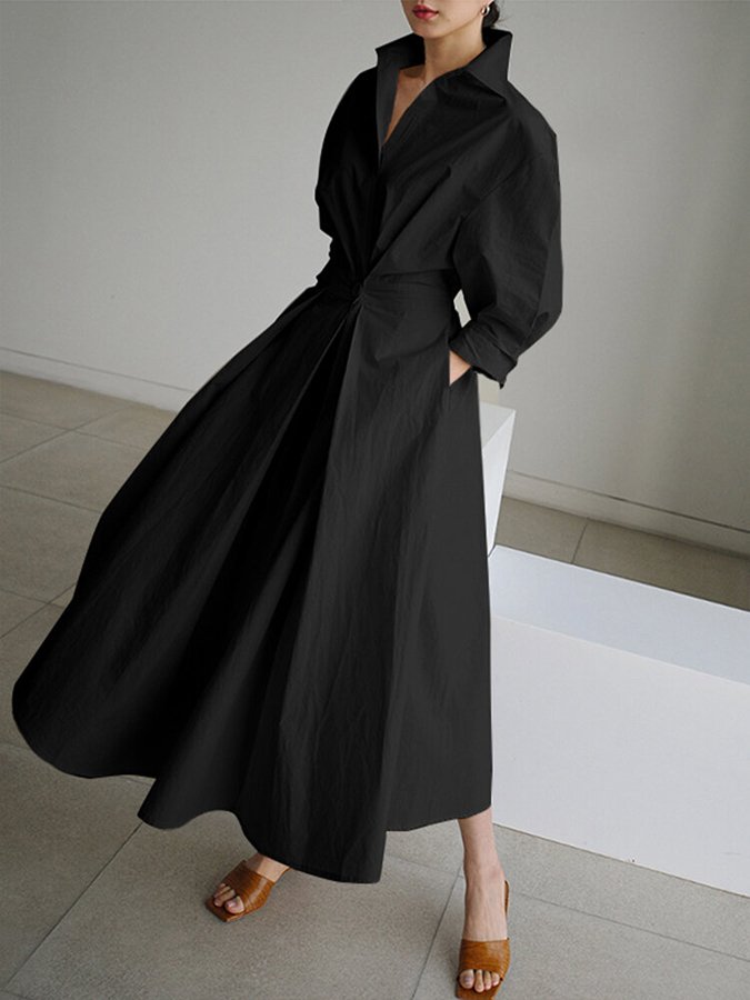Stylish women's button-front maxi dress with a defined waist belt, offering a relaxed yet polished look.