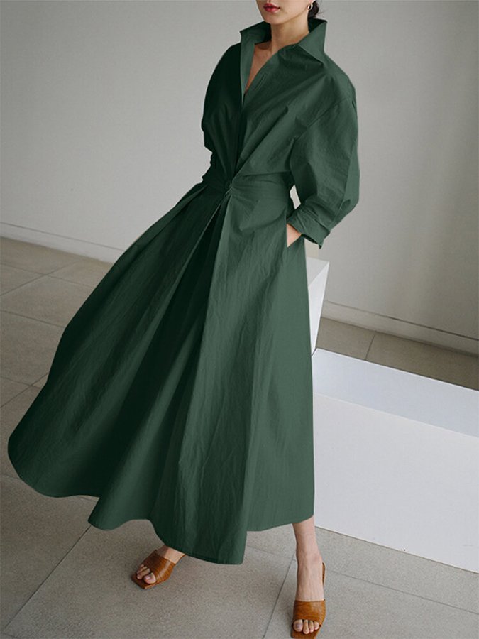 Fashionable women's maxi dress, combining the style of a shirt with a long, flowy skirt and a functional belt.