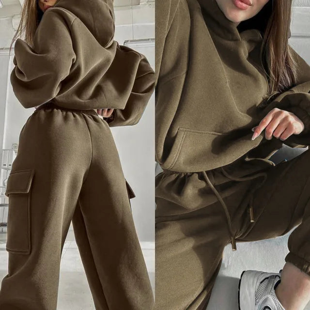 Model wearing a complete women's cargo hoodie and jogger set in olive green, casual