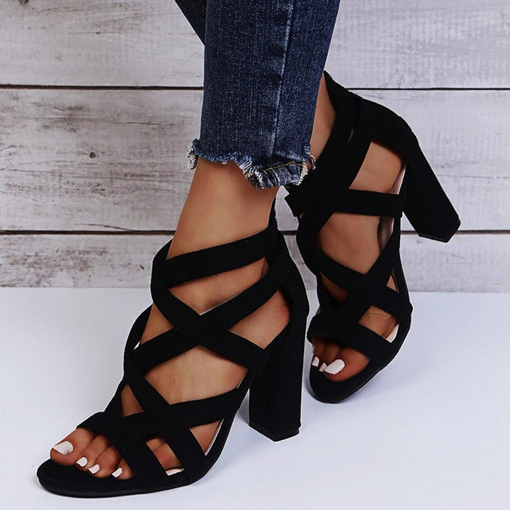 Elegant green strappy sandals with a chunky block heel, designed for women's occasion wear.