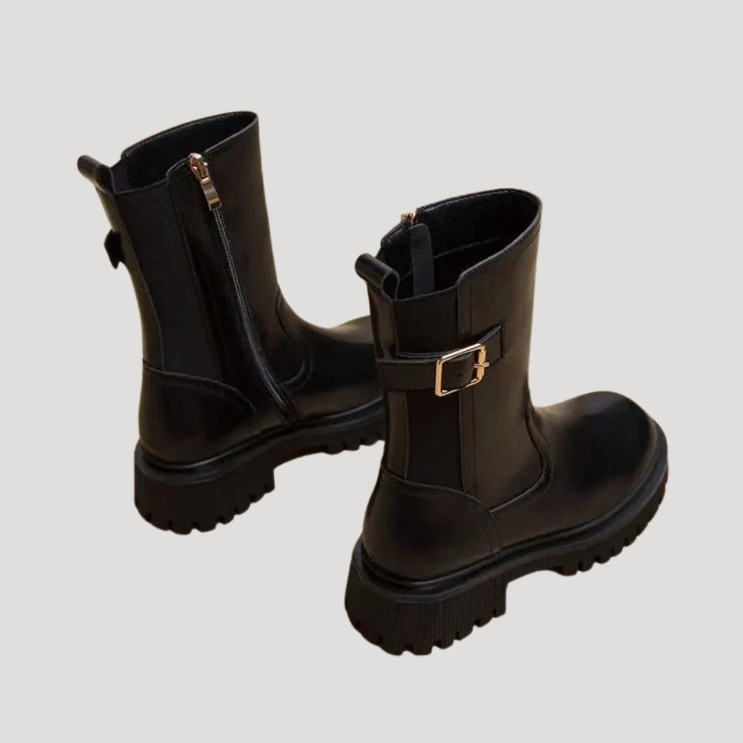 Women wearing black chunky mid-calf boots, showcasing trendy spring footwear