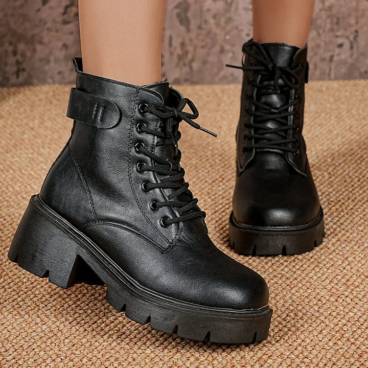 Stylish women's black platform lace-up ankle boots. Features chunky sole for a trendy & comfortable fit.