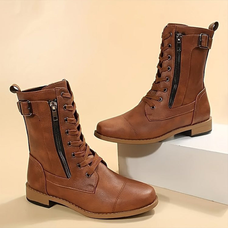 Women's black combat boots with side zip closure, rugged sole, and stylish ankle height for fall fashion.