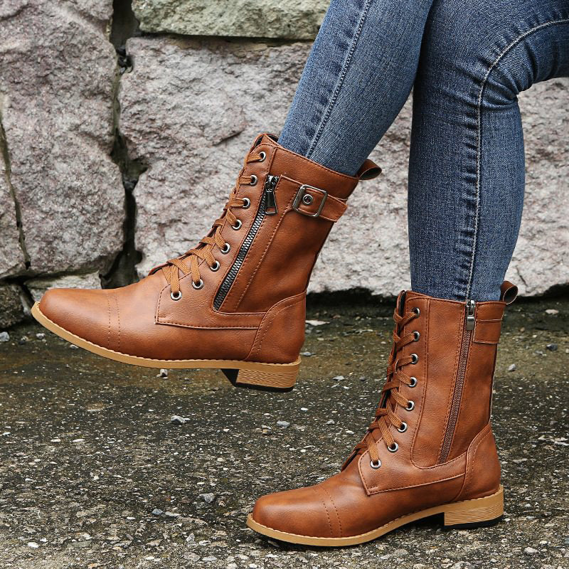 Detailed shot of the durable lug sole on women's combat boots, emphasizing grip and ruggedness.