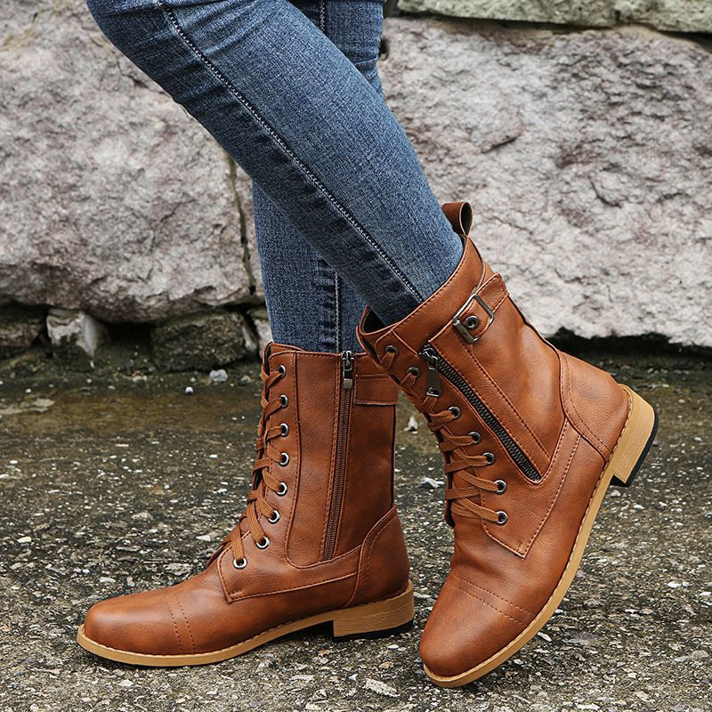 Close-up of the stitching and material on women's combat boots, highlighting quality and durability.
