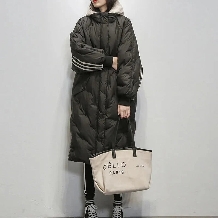 Padded women's long winter jacket in black, a warm and cozy insulated coat for cold weather days.