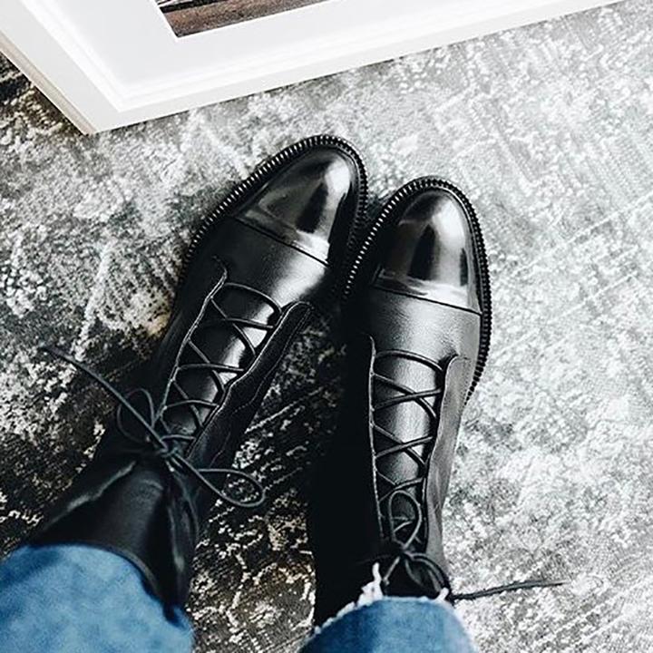 Women's durable leather boots with robust sole, lace-up closure for a secure fit.
