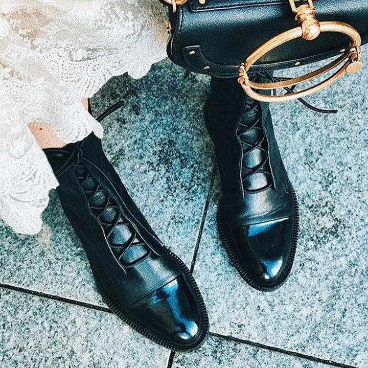 Fashionable women's leather ankle boots, lace-up design, ready for varied weather.