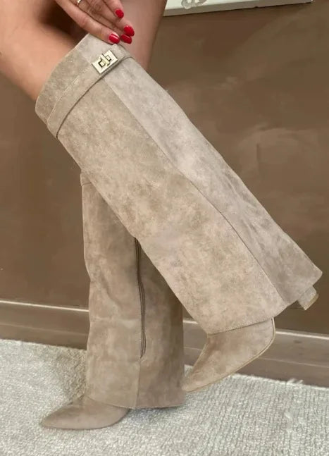 Pair of stylish women's leather thigh-high boots for fall and winter fashion