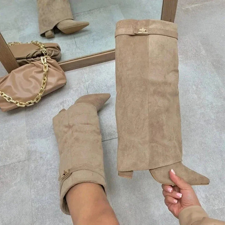 Heeled black leather thigh-high boots, perfect for a chic look