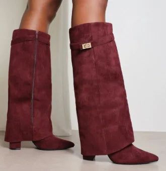 Back view of women's leather thigh-high boots, showing heel and shaft