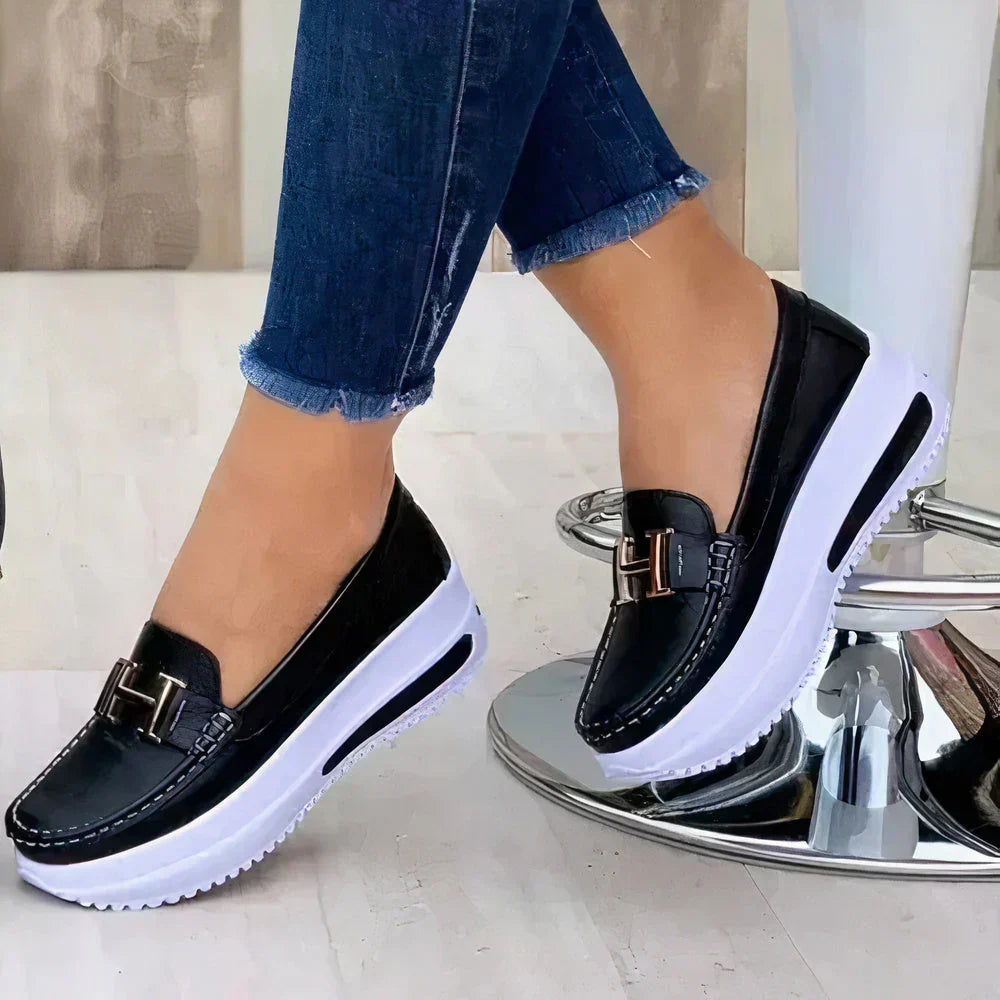 New women's platform loafers with a sleek slip-on style, perfect for contemporary fashion trends.