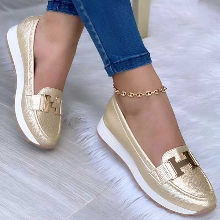Modern women's slip-on platform loafers. Fashionable chunky sole design offering comfortable everyday wear.