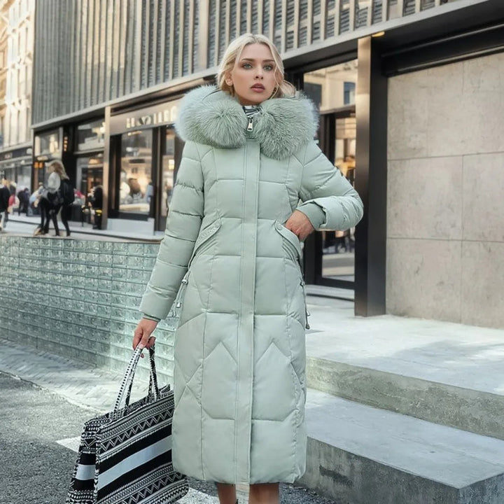 Full length shot of a women's black quilted winter coat with an attractive hooded design