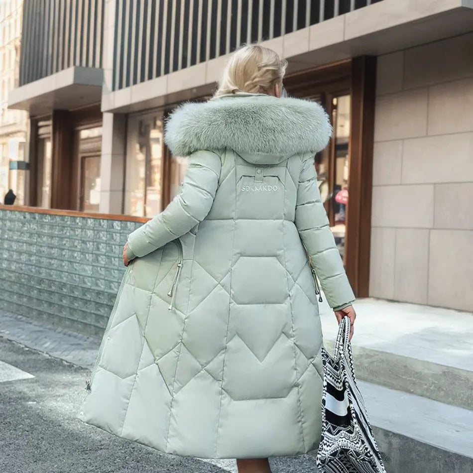 Women's winter fashion: dark quilted long coat with a practical and stylish hood