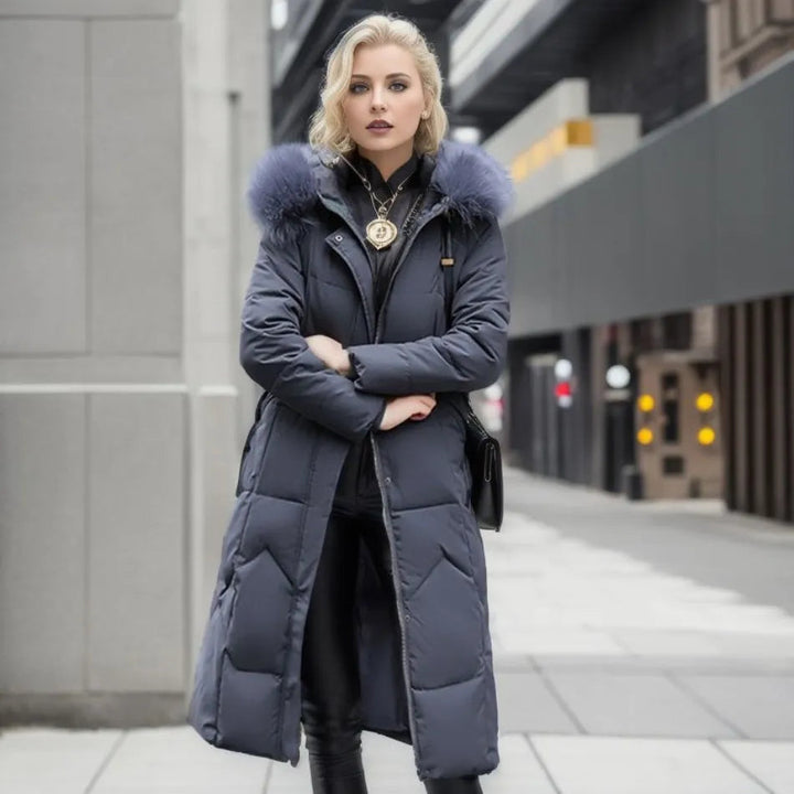 Comfortable women's long quilted winter coat with a warm hooded neckline and front zipper